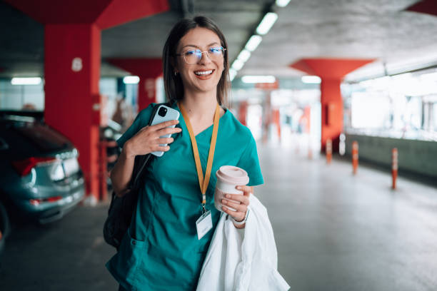 istock Young female nurse in scrubs going to work 1748386363