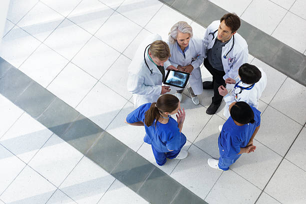istock Hospital staff talking about patient care 174838761