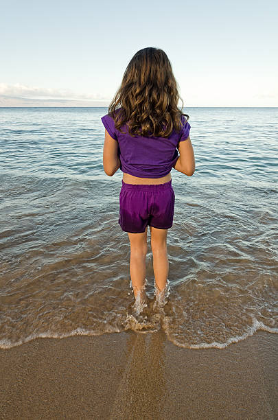 Girl Standing in Water stock photo