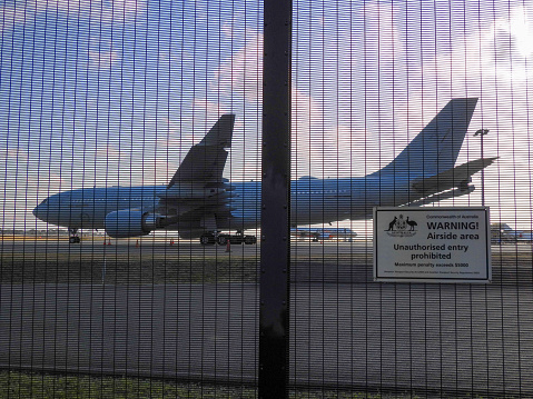 A Royal Australian Air Force Airbus KC-30A, the military version of an Airbus A330-200, registration A39-007, parked at Sydney Kingsford-Smith Airport.  The plane is named 