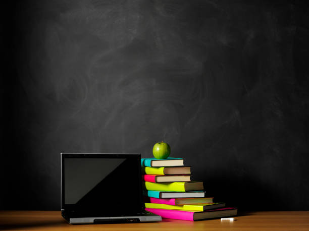 istock Books on the Teacher's Desk with a Laptop Computer 174839159