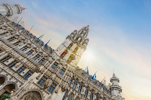 The architecturally detailed main facade of the historic town hall, a masterpiece of civic Gothic architecture. Located on the Grand Place (Grote Markt) in Brussels, Belgium, it was built between 1401 and 1455