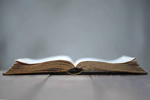 Photo of Open Book on table.