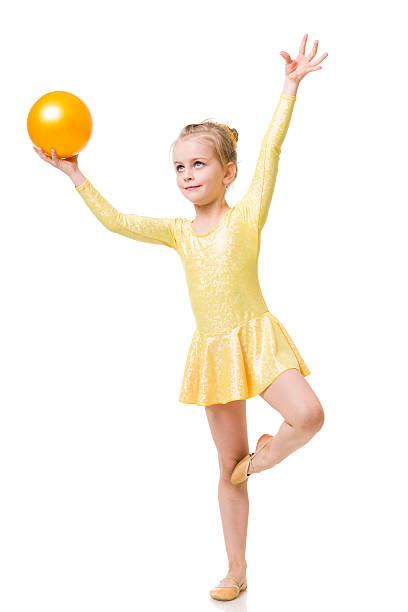 体操小さな女の子、リズミカルなボール、白で分離 - gymnastics smiling little girls only isolated on white ストックフォトと画像