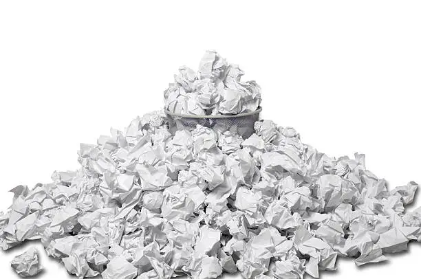 "Full wastepaper basket surrounded by crumpled paper, isolated on white.Related images:"