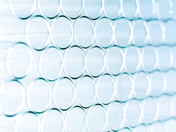 istock Droplet Falling from Pipette into Test Tube 174840404