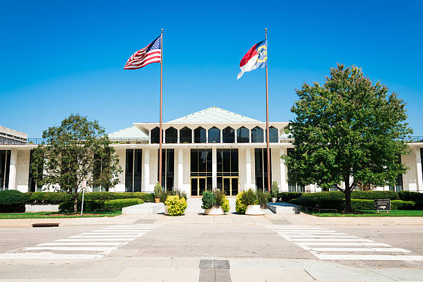 North Carolina Legislative Building Raleigh USA "North Carolina Legislative Building with American and North Carolina Flags in the wind. The North Carolina State Legislative Building is the meeting place of the North Carolina General Assembly, the state legislature of the U.S. state of North Carolina. Raleigh, North Carolina, USA" federal building stock pictures, royalty-free photos & images