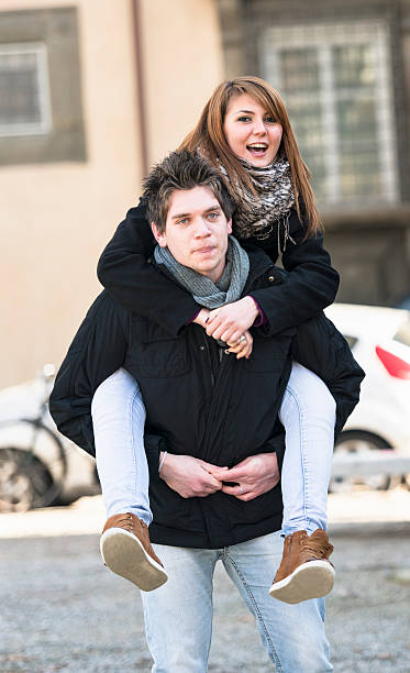 istock Friends piggyback outdoors 174840626