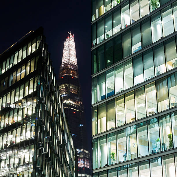 The Shard Modern glass facade at night on a corporate office . the shard close up stock pictures, royalty-free photos & images
