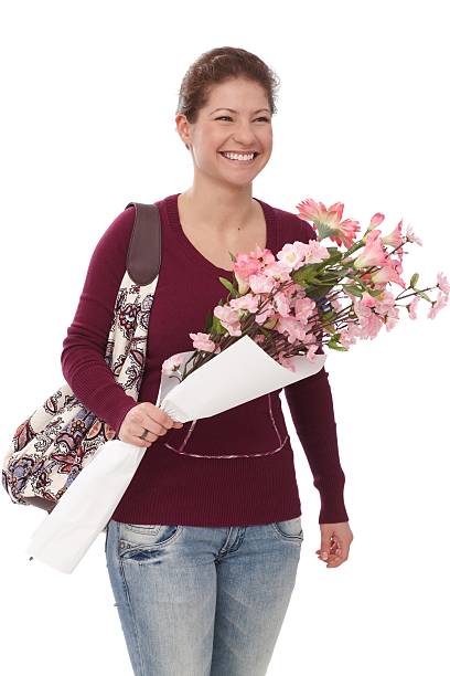 Portrait of happy woman with flowers stock photo