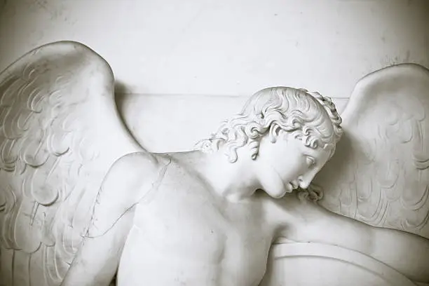 Typical classic angel - carved in huge series for graves all over Italy. 
