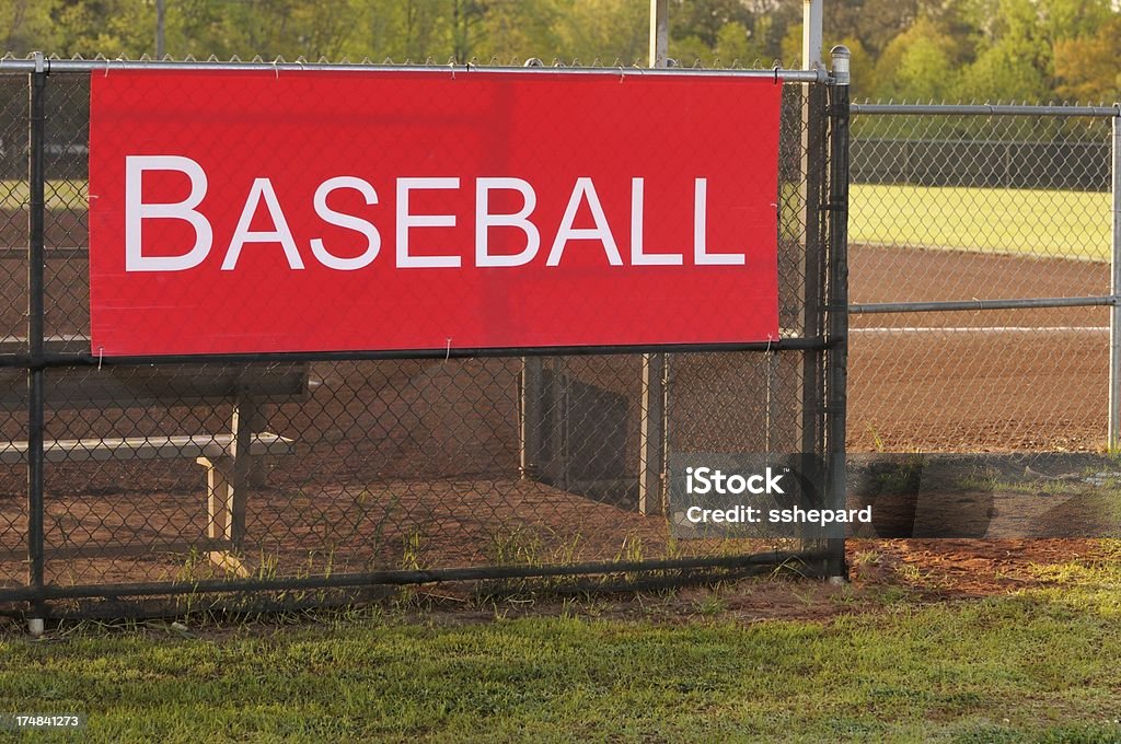Baseball sign on dugout Red baseball sign on field dugout fence Sports Dugout Stock Photo