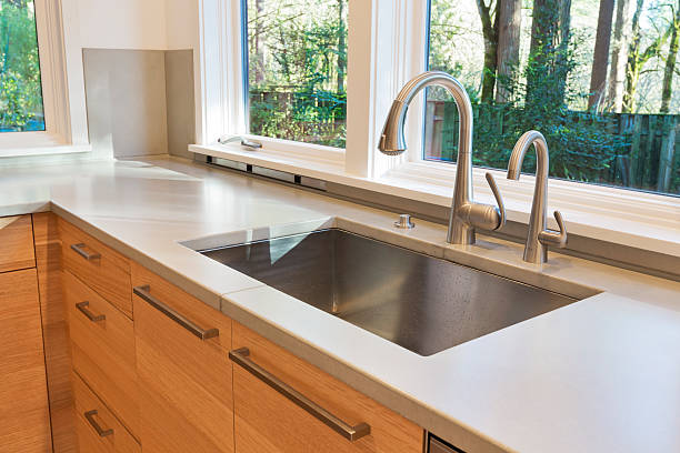 New modern clean kitchen counter with sink Nice, new kitchen sink. kitchen sink stock pictures, royalty-free photos & images
