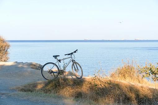 Mountain bike on the coastline against the background of blue sky and sea. No people. High quality photo