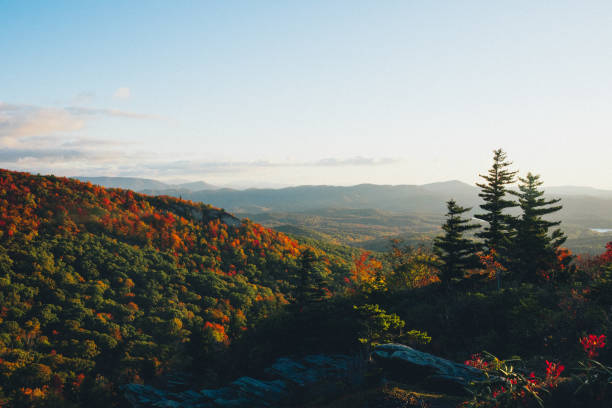 Autumn colors on display in Boone, North Carolina, shortly after sunrise on a mountain ridge
