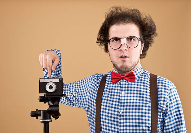istock Nerdy young photographer 174842372
