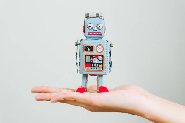 istock Hand hold vinatge robot, retro robot. 1748429617