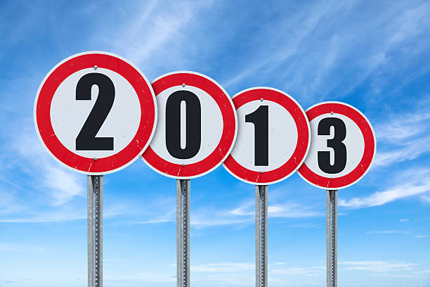 Blue sky over traffic sign showing year 2013