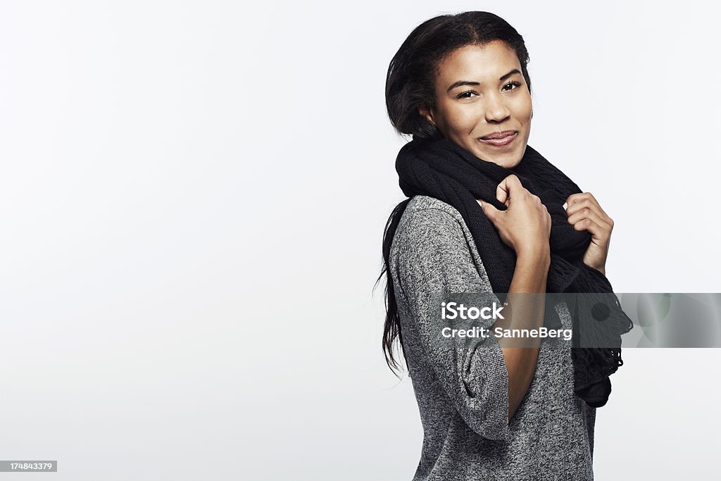 Portrait of young woman in scarf, smiling "Portrait of young woman in scarf, smiling" Gray Color Stock Photo