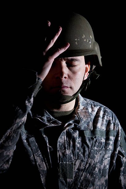 istock Soldier in Helmet Suffering from PTSD 174843502
