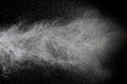 Close-up of a spraying isolated on black background.