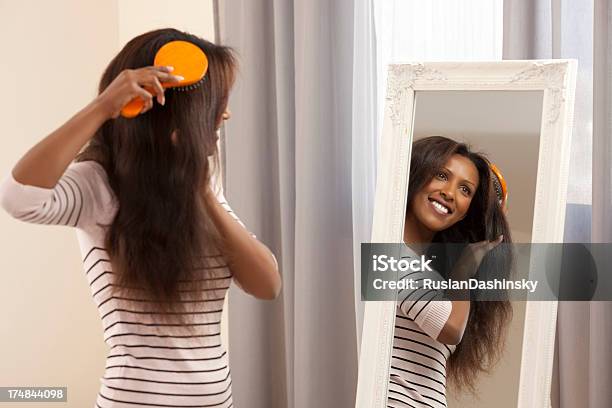 Woman Brushing Her Hair Stock Photo - Download Image Now - 25-29 Years, 30-34 Years, Adult