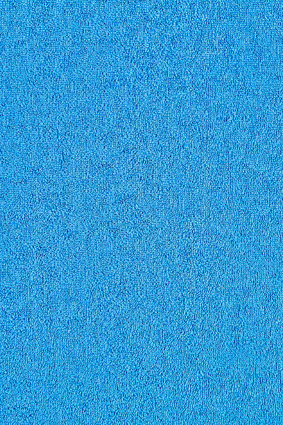 Blue Towel Background Background of a blue terrycloth towel. terry towel stock pictures, royalty-free photos & images