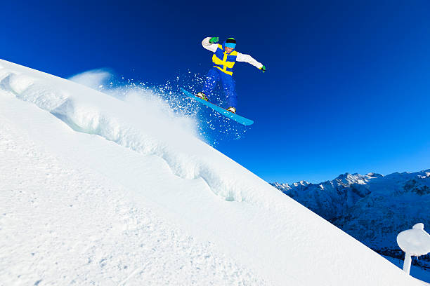 istock Freestyle snowboarder in a jump 174844666