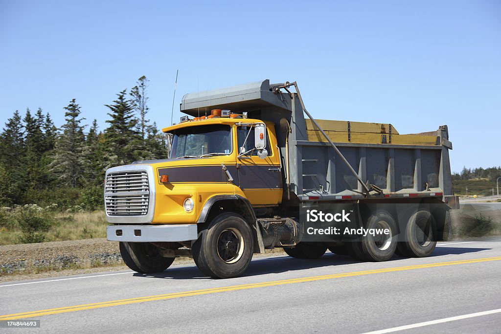 Dump truck Dump truck delivering its load. Selective focus on truck.For similar pictures go to Dump Truck Stock Photo