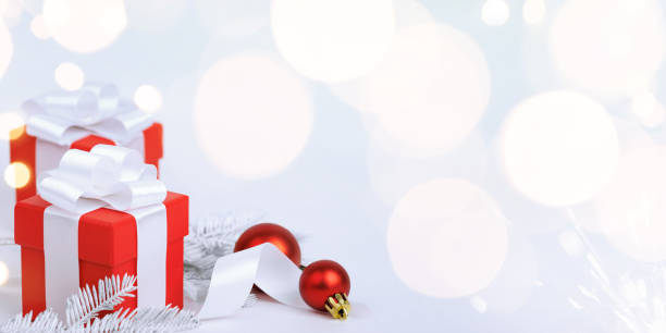 istock Christmas red gifts with decorations on white background 1748448336