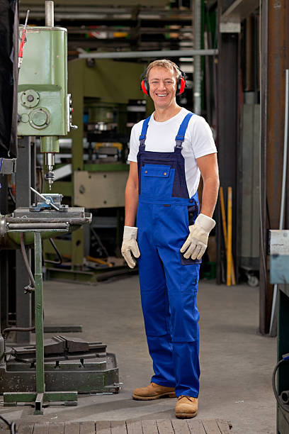 istock smiling craftsman in factory work room 174844887