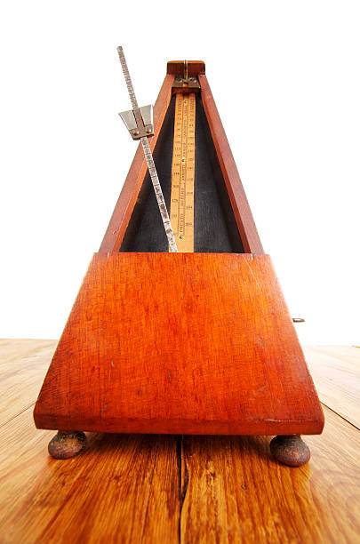 istock Antique Metronome On Wooden Surface 174844947