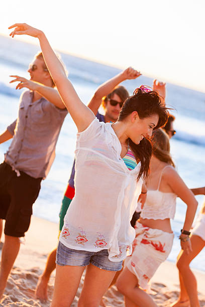 istock Group Of Young People At Beach Party 174845092