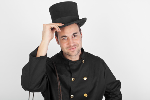 A young chimney sweep in front of a grey background