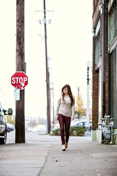 istock Stylized Urban Young Woman Walking Down the Street 174845478