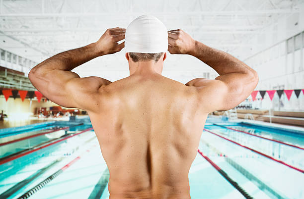 istock Rear view of a swimmer adjusting his cap 174845879