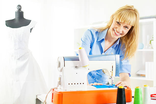 istock Cheerful Young Woman Sewing. 174845880