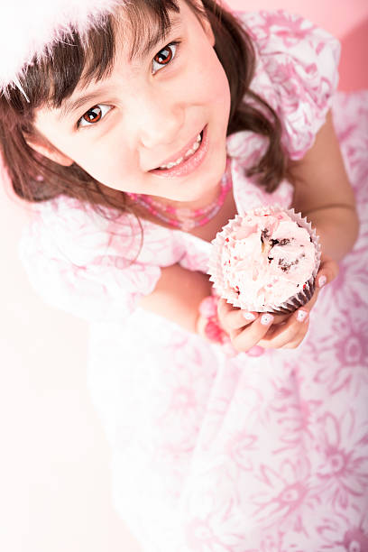 Young girl dressing up as a princess
