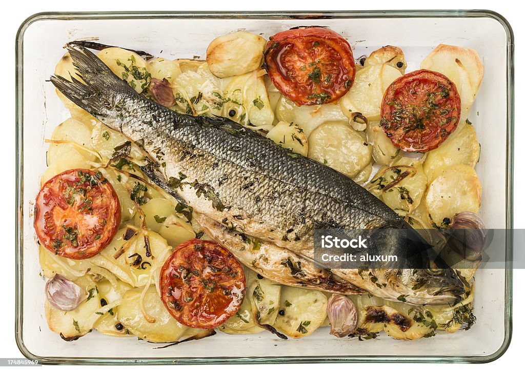 Branzino cotto al forno - Foto stock royalty-free di Branzino