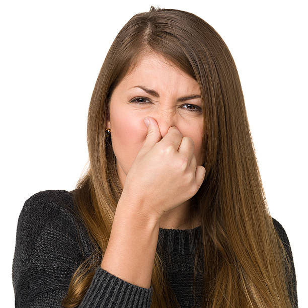 istock Young Woman Pinching Her Nose 174846054