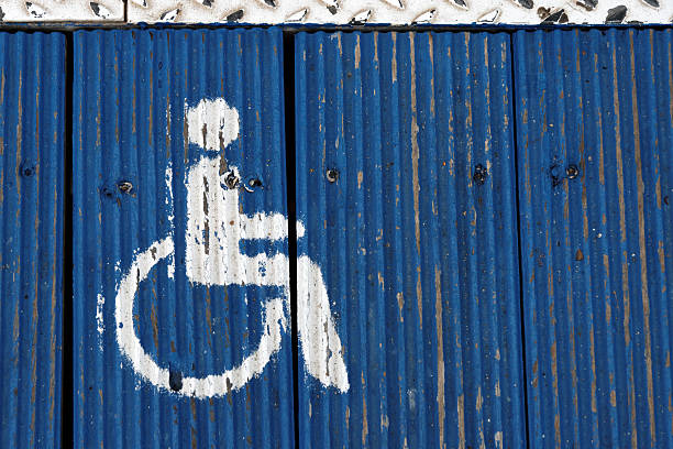 знак инвалид - weatered стоковые фото и изображения