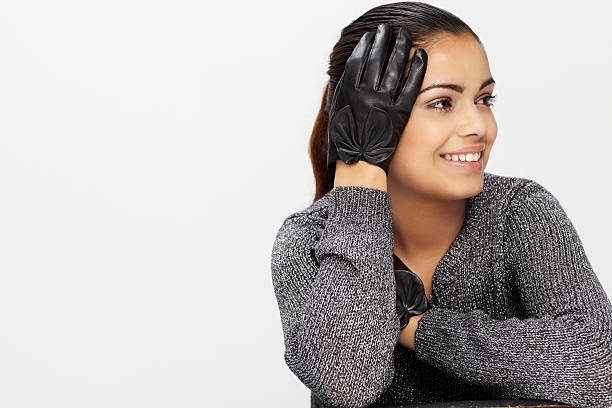 Young woman wearing leather glove