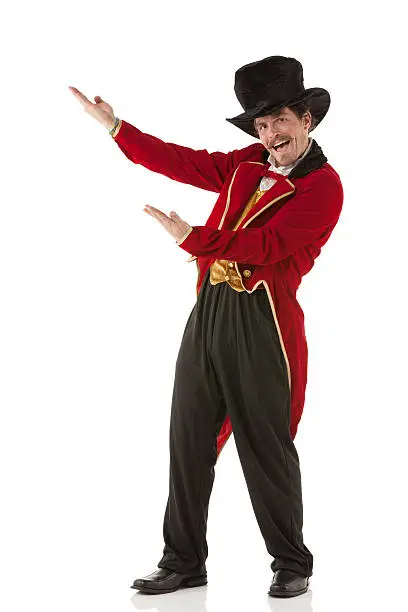 Photo of Portrait of a happy ringmaster gesturing