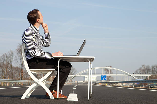 istock Young businessman working on the road 174847130