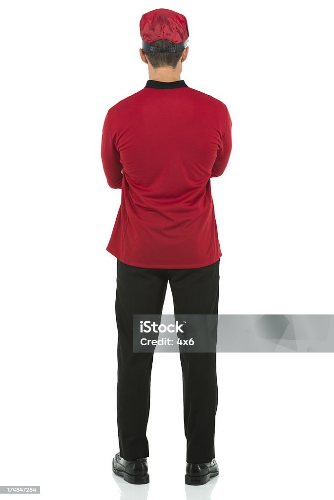 Vista traseira de um valet pé com os braços cruzados - Royalty-free 30-39 Anos Foto de stock