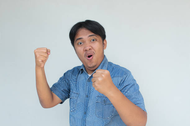 istock Young asian man with happy and excited expression 1748478183