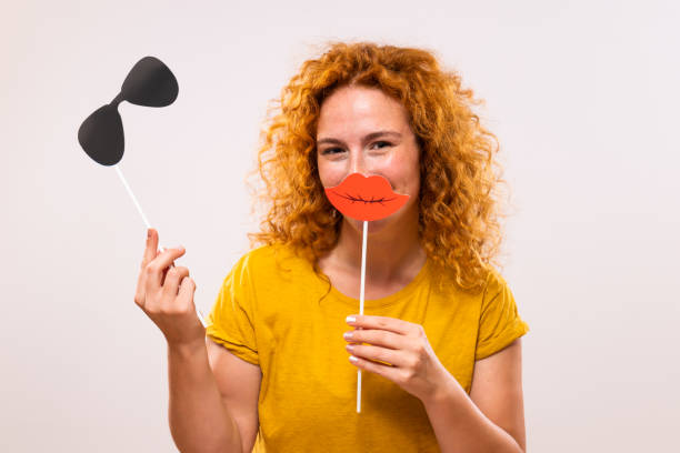 istock Ginger woman with party props 1748480614