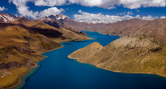 View from Yamdrok High Pass of the Turquoise Lake (16,860ft) and the Tibetan Plateau in Tibet.