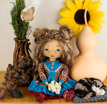 Handmade textile doll with pumpkin, vase and cat.