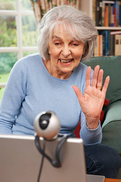 istock Senior Woman Using Webcam To Talk With Family 174849106